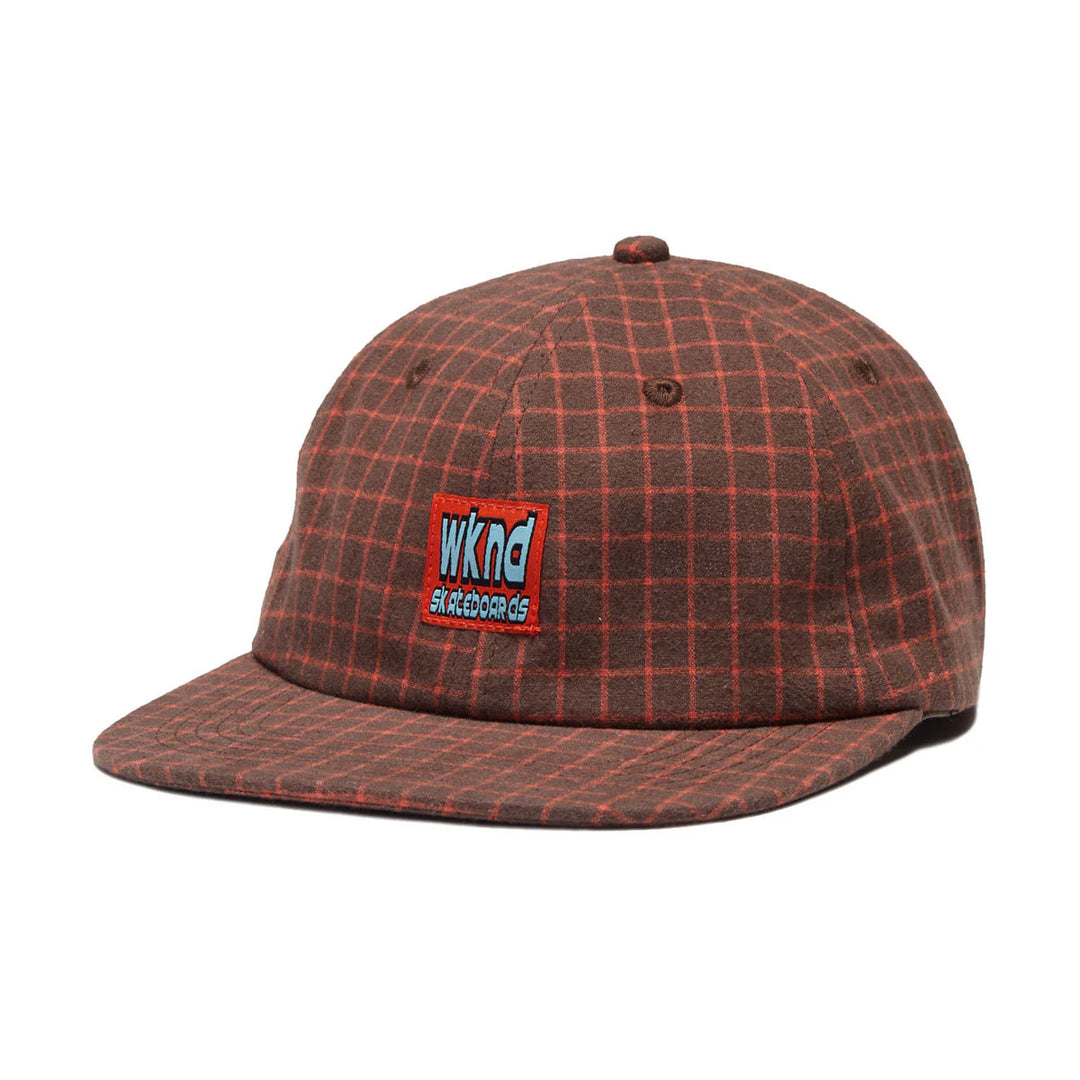 Plaid patterned cap with a logo on a white background
