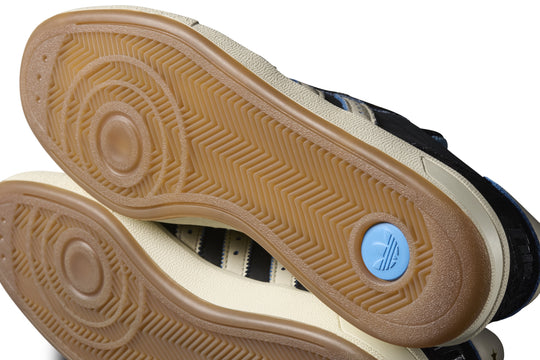 Close-up of a shoe sole with a brand logo on a white background