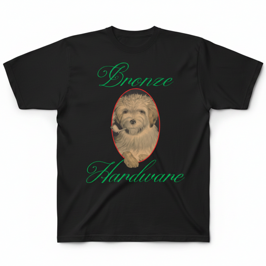 A black short-sleeve t-shirt with a graphic print featuring a fluffy light brown dog inside an oval with a red border, with the words &