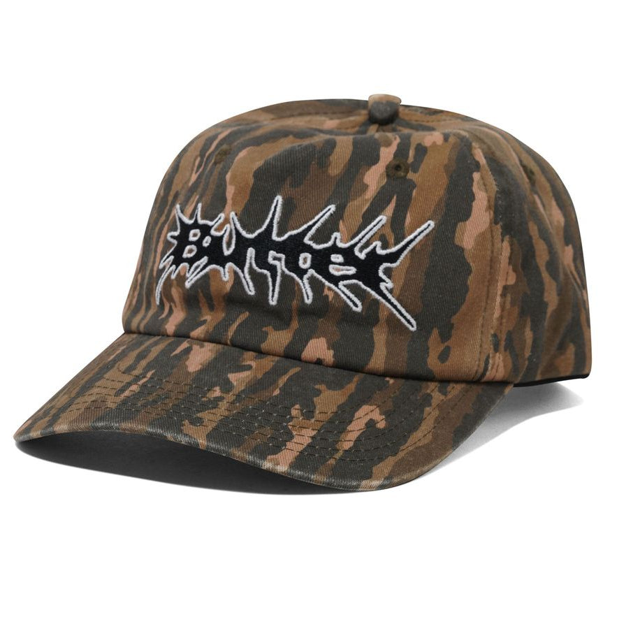 Camouflage-patterned cap with a white logo on a white background
