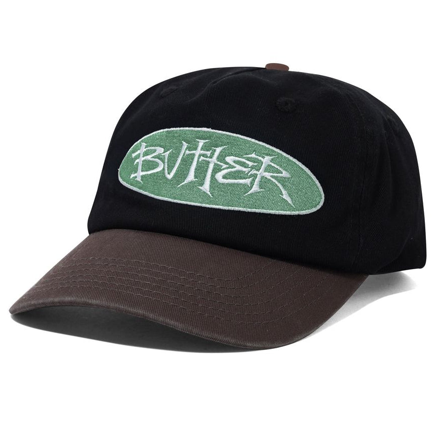 Black cap with a green logo on a white background