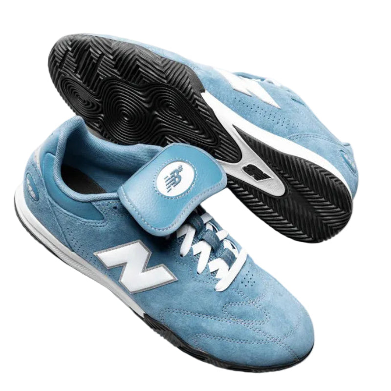 Blue sneakers with white accents on a white background