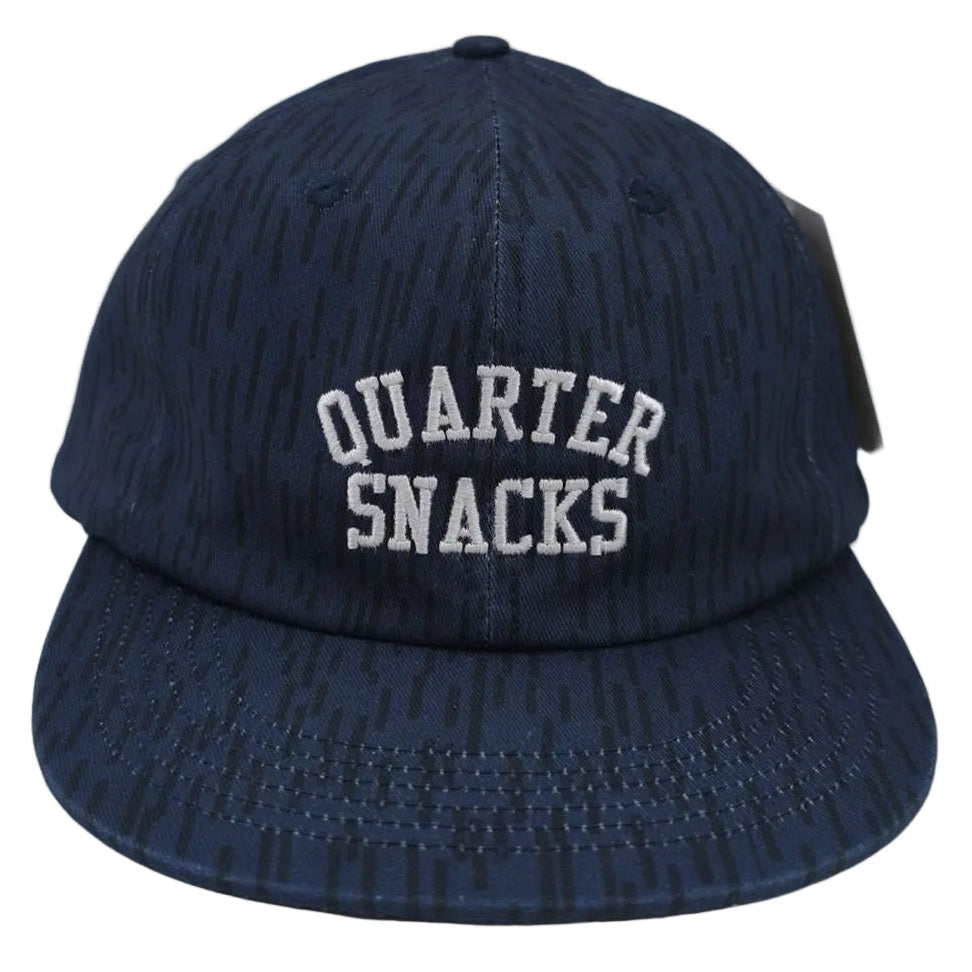 Navy blue cap with 'Quarter Snacks' text on a white background