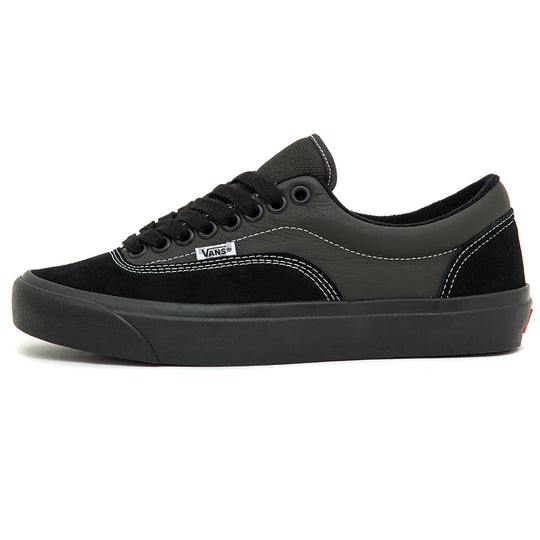 Black and gray sneaker with Vans logo on a white background