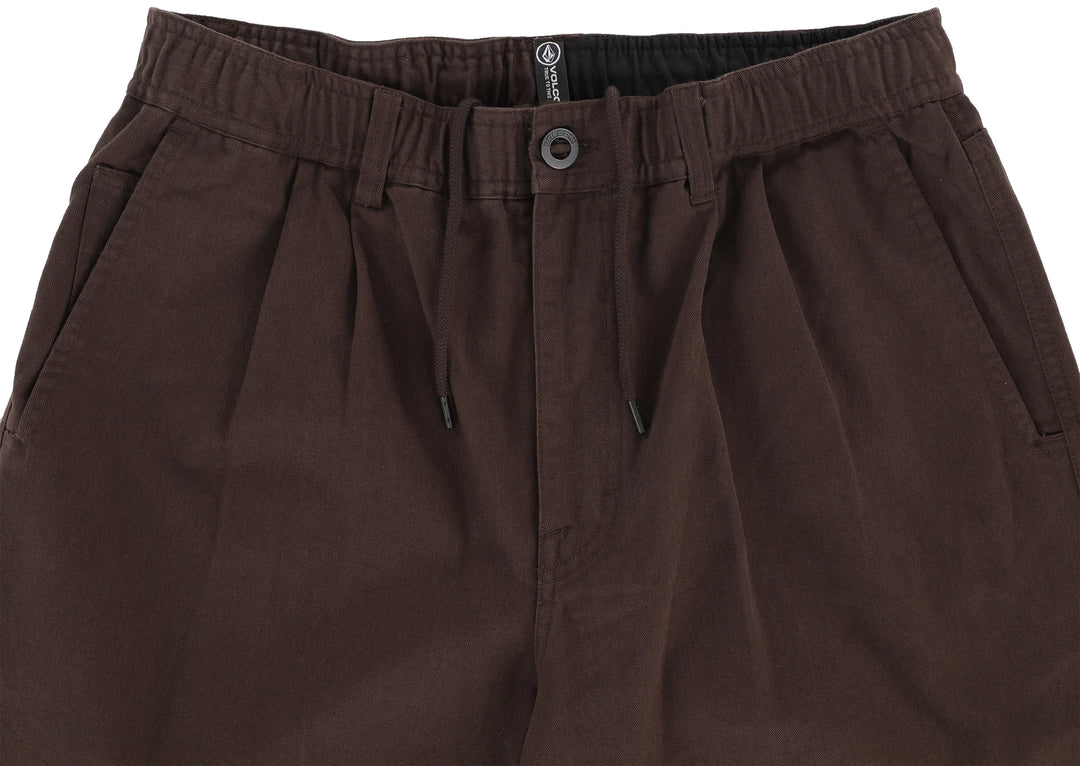 Brown pants with a button and zipper on a white background