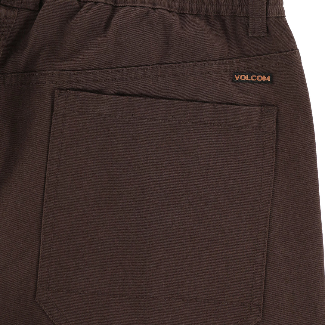Brown pants with Volcom logo on a white background