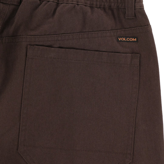 Brown pants with Volcom logo on a white background